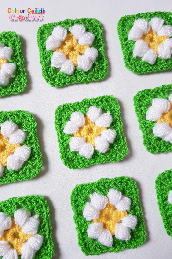 This is an easy crochet puff daisy granny square pattern for a small daisy flower in bright and cheerful colours.