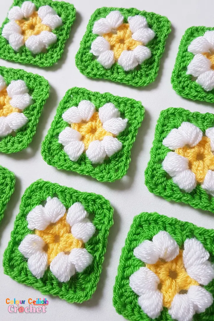 This is an easy crochet puff daisy granny square pattern for a small daisy flower in bright and cheerful colours.