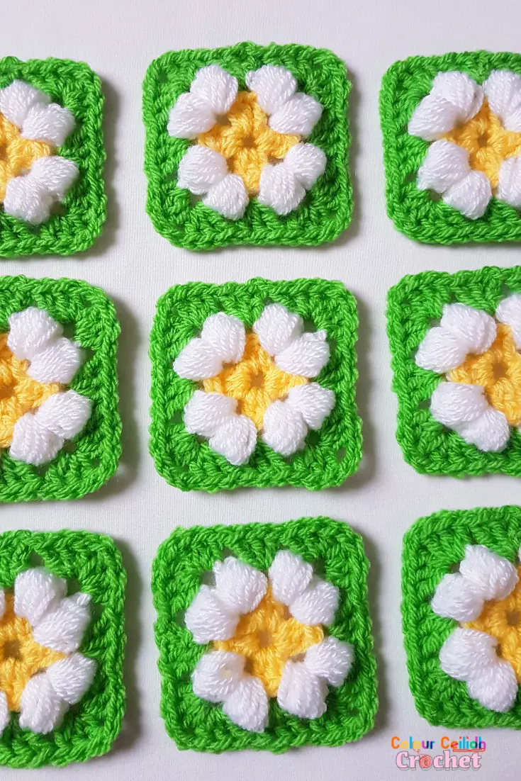 This is an easy crochet puff daisy granny square pattern for a small daisy flower in bright and cheerful colours.