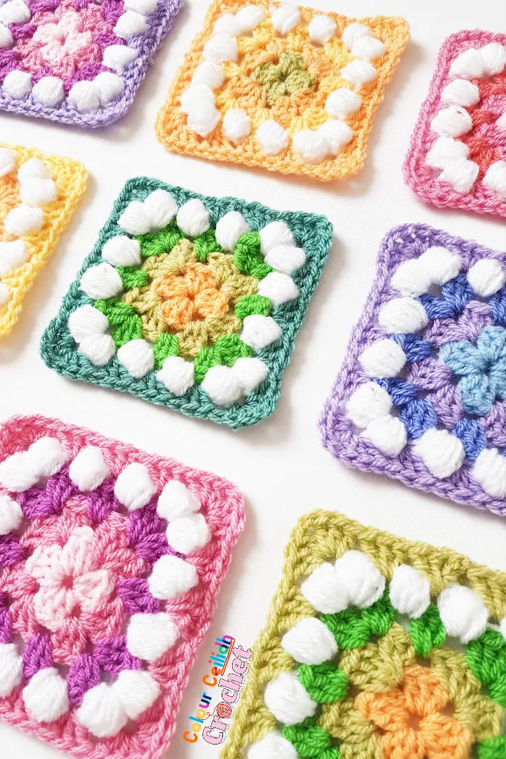 Colorful and cheerful granny squares with granny and puff stitch.