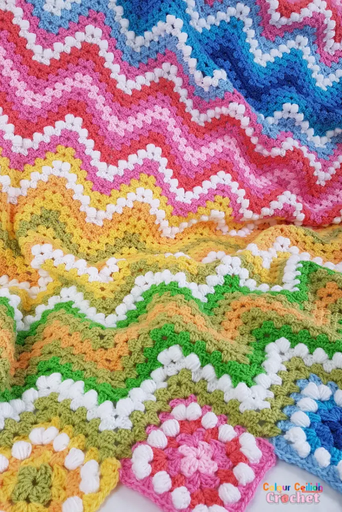 This crochet ripple blanket pattern is great for spring and summer and reminds me of a spring landscape with yellow and pink flowers. A beginner who has never worked a granny stitch or a ripple will find it easy to crochet this blanket thanks to photo tutorials. Make this beginner friendly granny ripple afghan to brighten up a sad looking armchair in the corner and to brighten up your day!