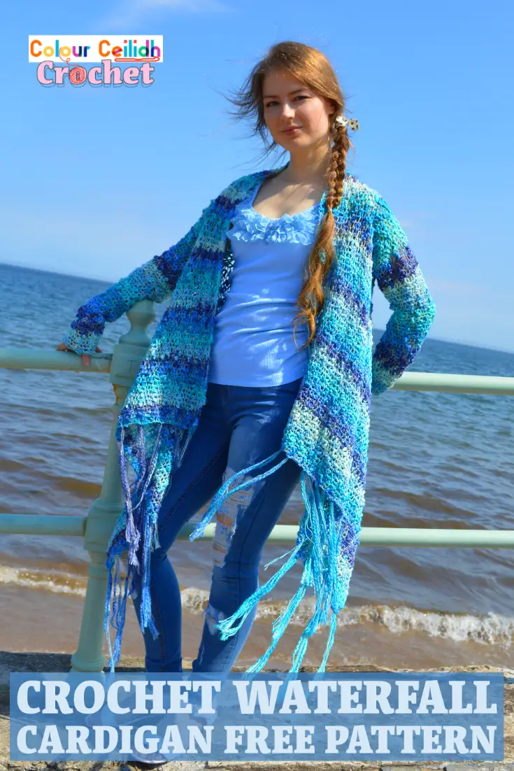 This easy crochet cardigan pattern Waterfall is a free pattern and is perfect for a relaxed summer day at the beach. Using a super simple double crochet stitch, the body is worked in a rectangle and then the sleeves and the tassel fringe are added. The asymmetric hem is playful and fun. Net like stitch, texture that reminds me of the sea waves, blue ocean colors, waterfall drape... What a creative experience! It's like I'm weaving the landscape of the sea around my shoulders. #crochetcardigan