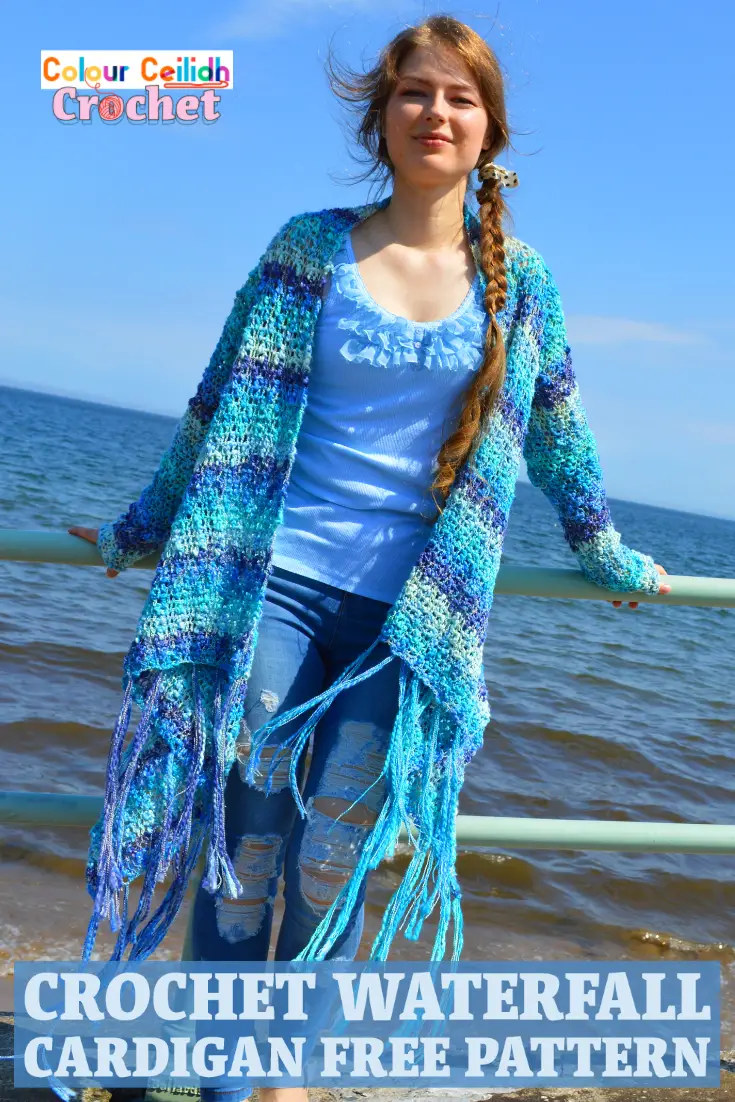 This easy crochet cardigan pattern Waterfall is a free pattern and is perfect for a relaxed summer day at the beach. Using a super simple double crochet stitch, the body is worked in a rectangle and then the sleeves and the tassel fringe are added. The asymmetric hem is playful and fun. Net like stitch, texture that reminds me of the sea waves, blue ocean colors, waterfall drape... What a creative experience! It's like I'm weaving the landscape of the sea around my shoulders. #crochetcardigan