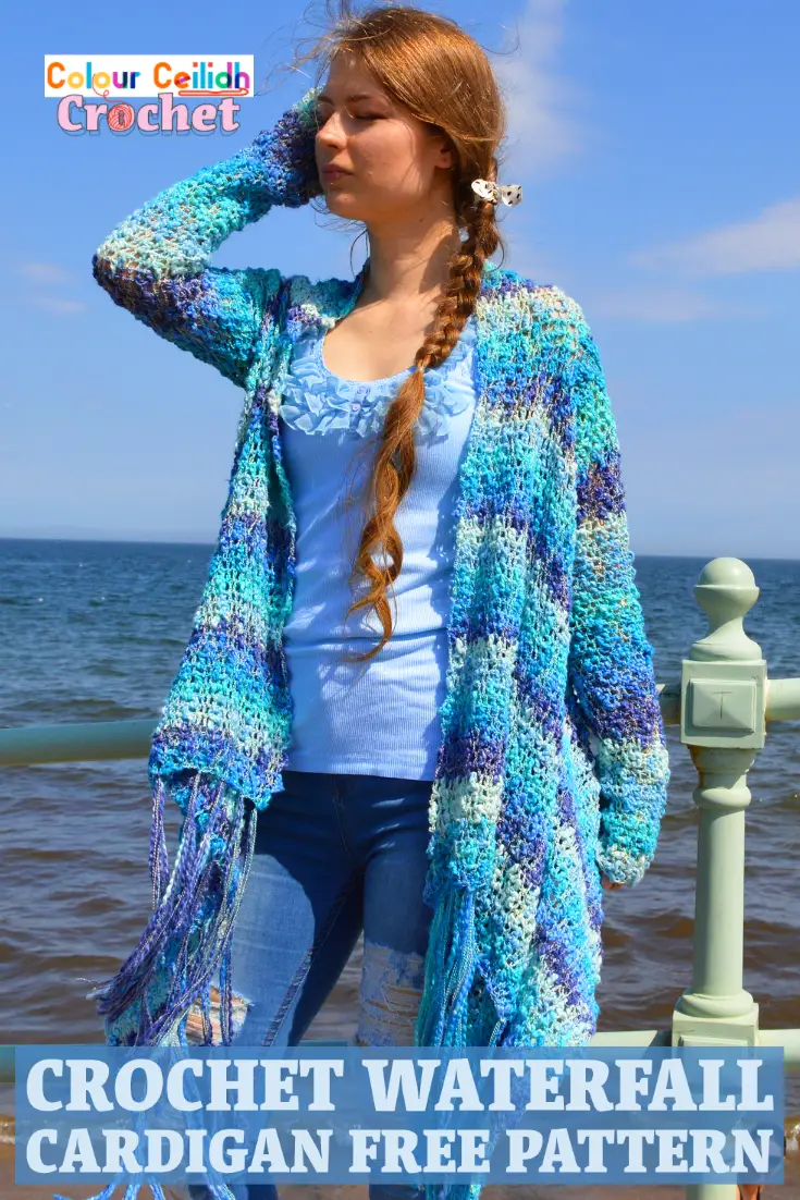 This easy crochet cardigan pattern Waterfall is a free pattern and is perfect for a relaxed summer day at the beach. Using a super simple double crochet stitch, the body is worked in a rectangle and then the sleeves and the tassel fringe are added. The asymmetric hem is playful and fun. Net like stitch, texture that reminds me of the sea waves, blue ocean colors, waterfall drape... What a creative experience! It's like I'm weaving the landscape of the sea around my shoulders. #crochetcardigan