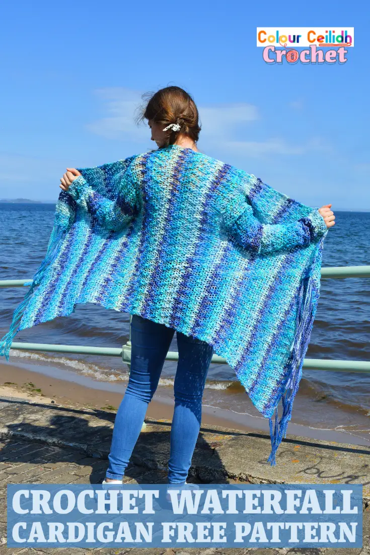 This easy crochet cardigan pattern Waterfall is a free pattern and is perfect for a relaxed summer day at the beach. Using a super simple double crochet stitch, the body is worked in a rectangle and then the sleeves and the tassel fringe are added. The asymmetric hem is playful and fun. Net like stitch, texture that reminds me of the sea waves, blue ocean colors, waterfall drape... What a creative experience! It's like I'm weaving the landscape of the sea around my shoulders. #crochetcardigan