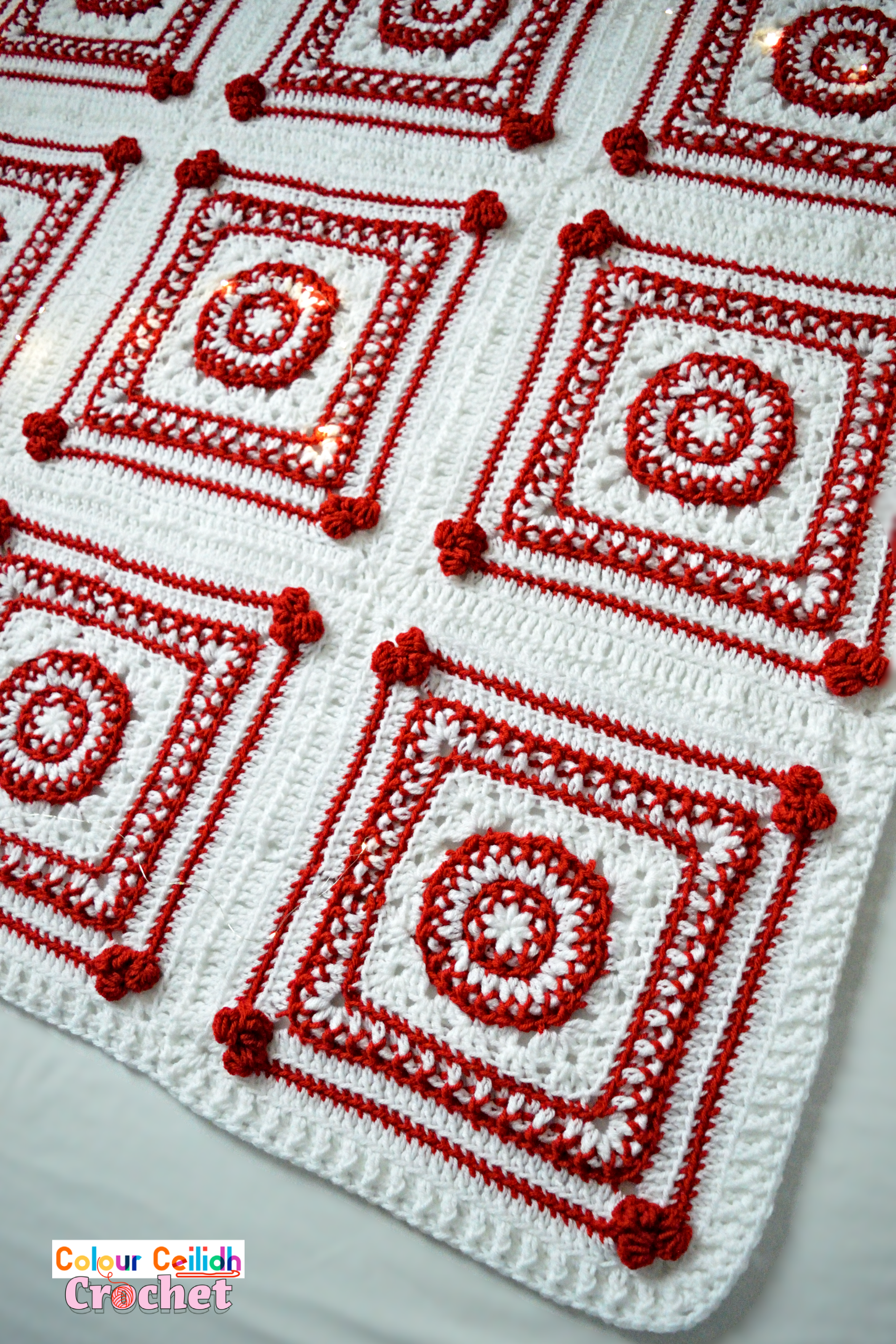 This Christmas crochet blanket pattern is a Scandinavian style afghan with bobble hearts and eight-pointed Nordic stars. Using worsted weight yarn I combine two bold red and white colors for maximum effect to instantly set the Christmas atmosphere. This free pattern includes a YouTube video tutorial. Matching Scandinavian style crochet baubles are available as a separate pattern.