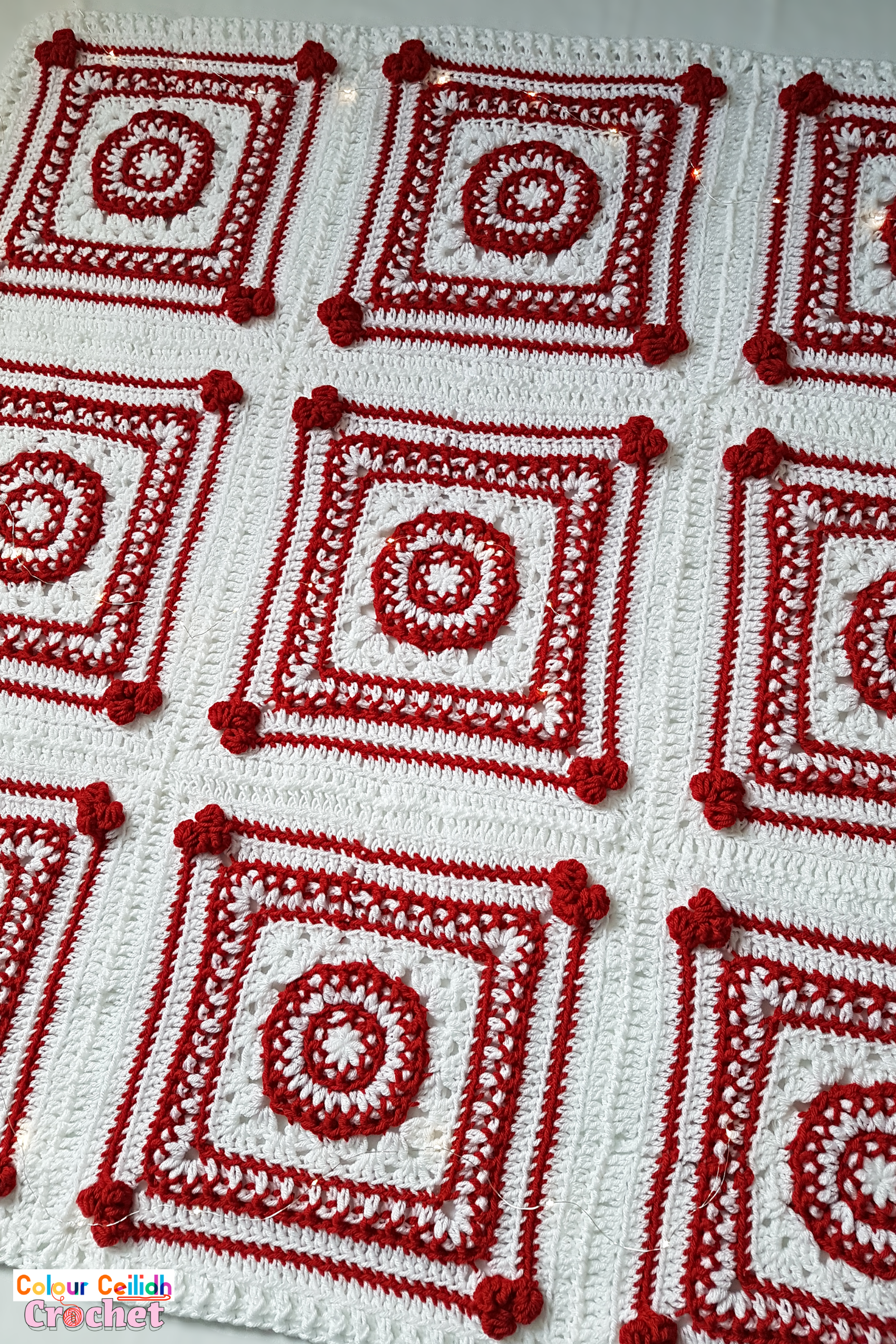This Christmas crochet blanket pattern is a Scandinavian style afghan with bobble hearts and eight-pointed Nordic stars. Using worsted weight yarn I combine two bold red and white colors for maximum effect to instantly set the Christmas atmosphere. This free pattern includes a YouTube video tutorial. Matching Scandinavian style crochet baubles are available as a separate pattern.