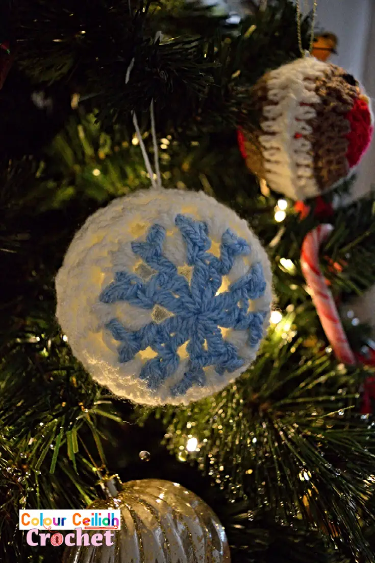 This easy crochet snowflake bauble is made with the granny stitch and is suitable for beginners. The lace looks great on a see-through bauble, especially if you hang it in front of some twinkling Christmas lights. It makes a great addition to your handmade crochet Christmas ornaments. Oh and there is no starch involved!